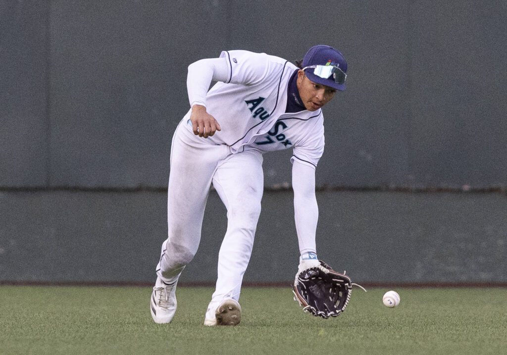 Everett AquaSox outfielder Tai Peete picks up a ball hit to the outfield during the game against the Tri-City Dust Devils on Wednesday, May 7, 2025 in Everett, Washington. (Olivia Vanni / The Herald)
