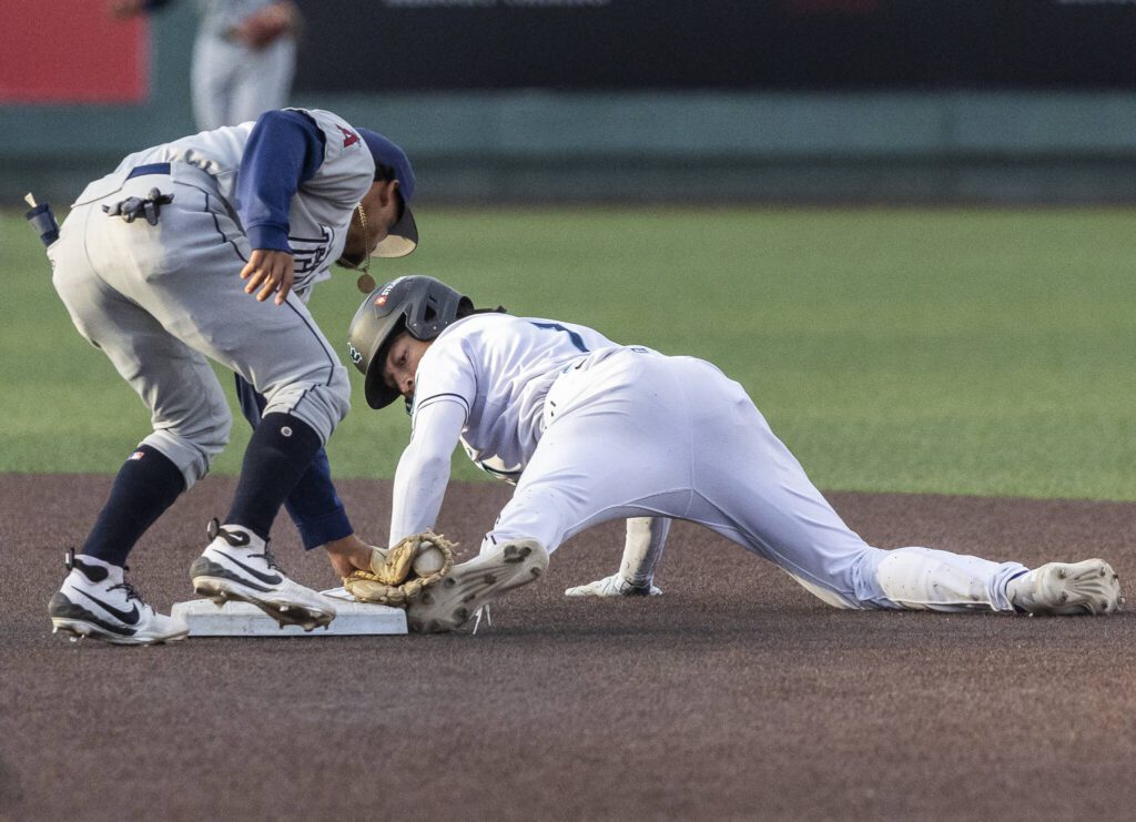 Everett AquaSox outfielder Tai Peete looks back at his foot after sliding into second base during the game against the Tri-City Dust Devils on Wednesday, May 7, 2025 in Everett, Washington. (Olivia Vanni / The Herald)
