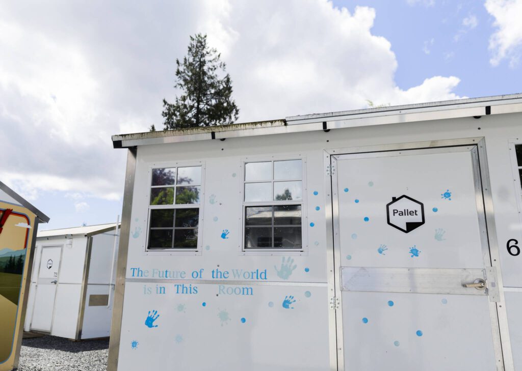 The outside of one of the Pallet homes covered in art on Monday, May 19, 2025 in Everett, Washington. (Olivia Vanni / The Herald)
