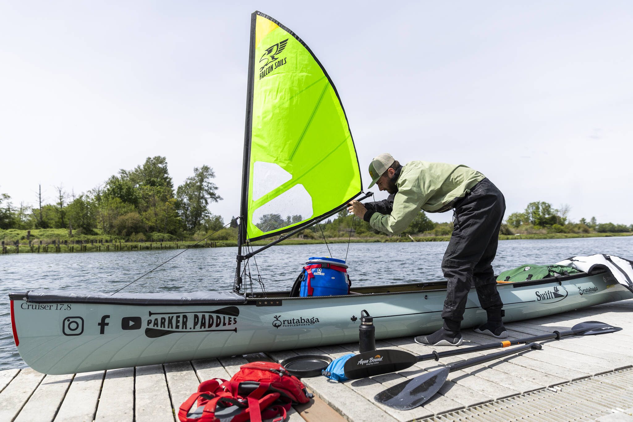 Kyle Parker shows a custom sail made for his canoe on Thursday, May 8, 2025 in Everett, Washington. (Olivia Vanni / The Herald)