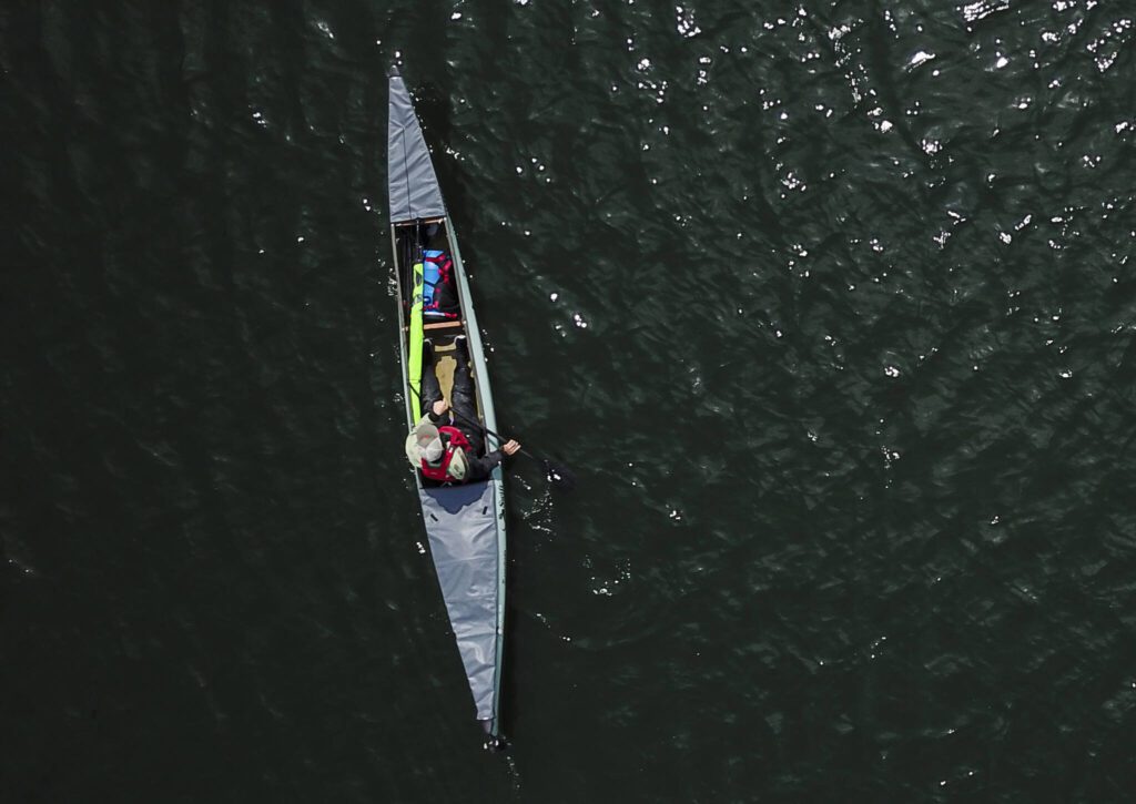 Kyle Parker paddles his canoe along the Snohomish River on Thursday, May 8, 2025 in Everett, Washington. (Olivia Vanni / The Herald)
