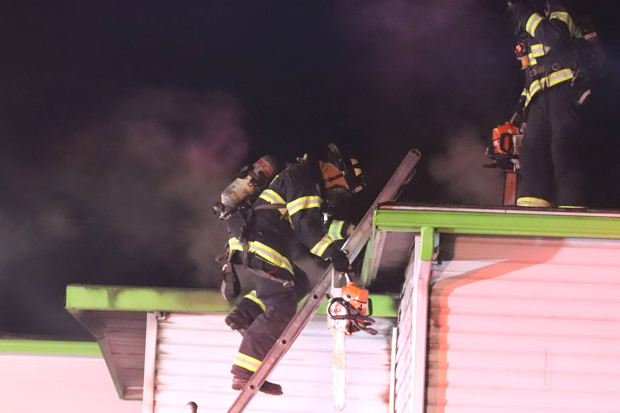 Everett firefighters extinguish an apartment fire early Friday morning in the Pinehurst neighborhood. (Everett Fire Department)