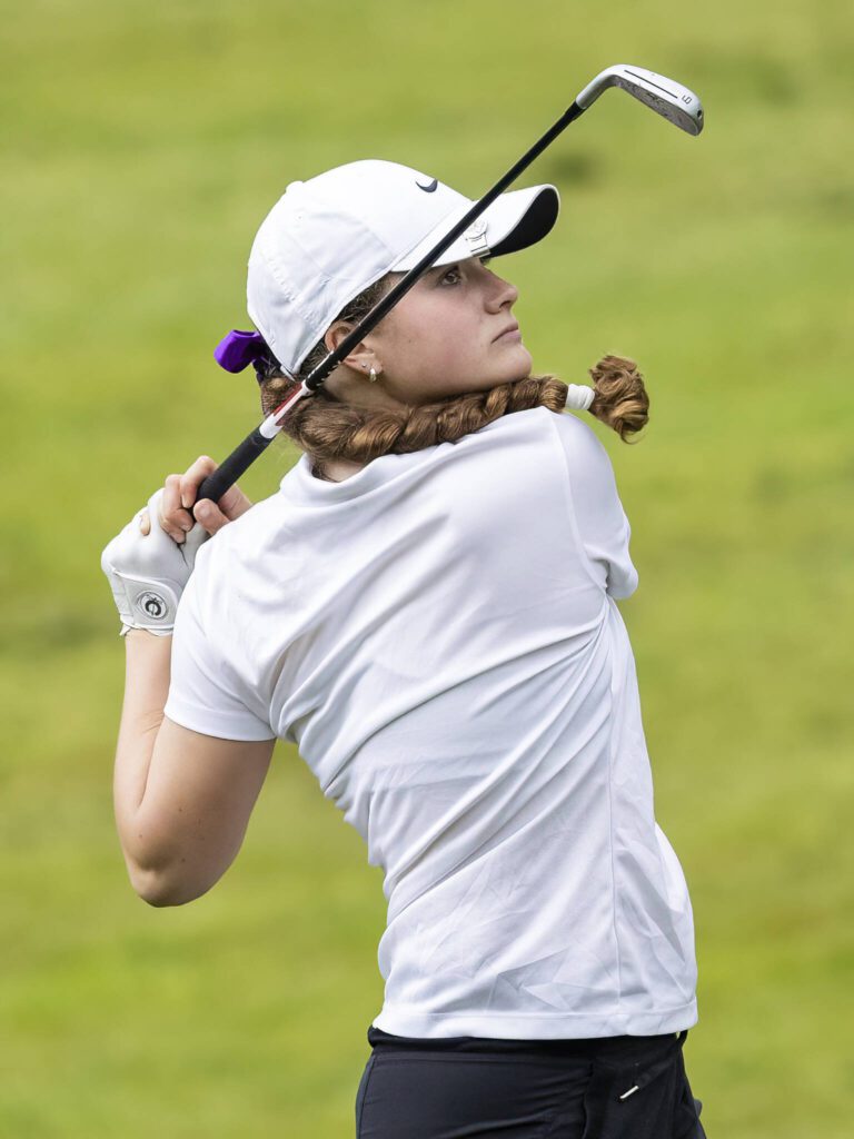 Kamiak’s Sarah Dyer uses an iron from the tee box during the 4A District 1 Golf Tournament at Snohomish Golf Course on Wednesday, May 14, 2025 in Snohomish, Washington. (Olivia Vanni / The Herald)

