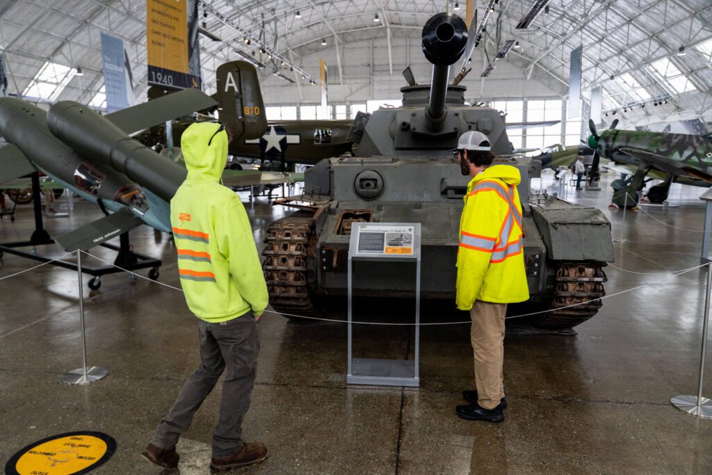 Visitors look at a historic tank during Paine Field Community Day on Saturday, May 17, 2025, in Everett, Washington. (Will Geschke / The Herald)
