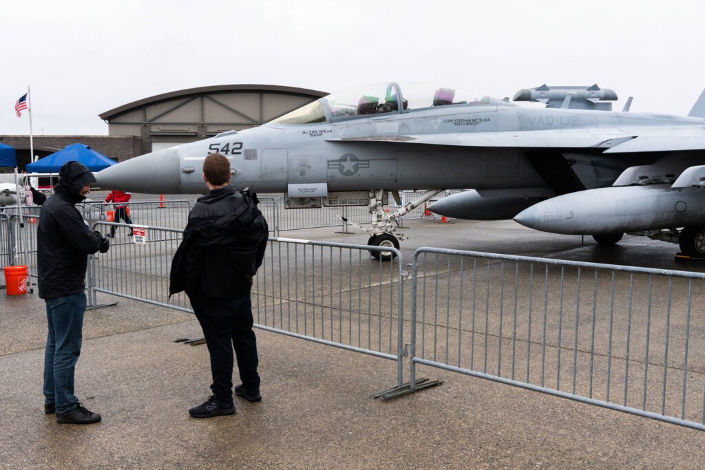 Visitors look at an F/A 18 Super Hornet during Paine Field Community Day on Saturday, May 17, 2025, in Everett, Washington. (Will Geschke / The Herald)
