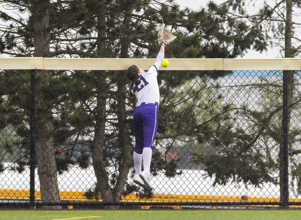 The ball flies past the outstretched glove of Edmonds-Woodway’s Catie Ingalls in the outfield during the 3A District 1 consolation game against Snohomish on Thursday, May 15, 2025 in Snohomish, Washington. (Olivia Vanni / The Herald)
