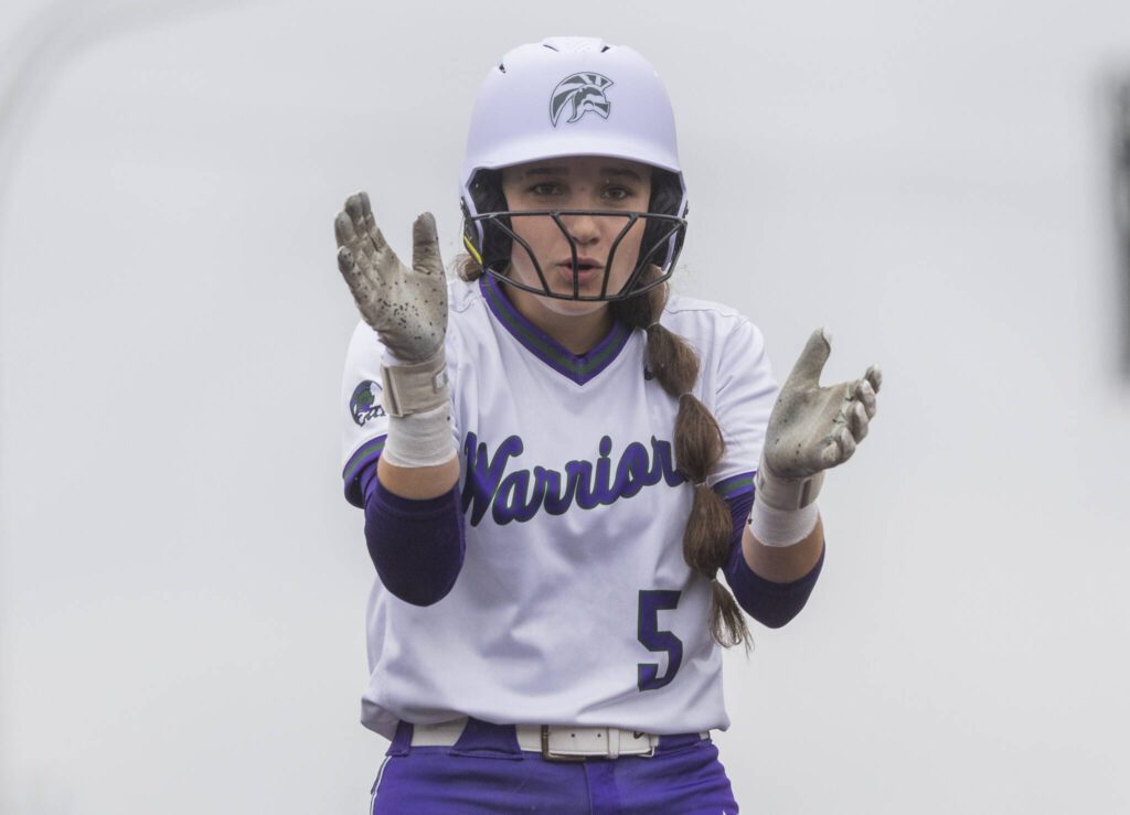 Edmonds-Woodway’s Ellie Alderson claps after making it to third base during the 3A District 1 consolation game against Snohomish on Thursday, May 15, 2025 in Snohomish, Washington. (Olivia Vanni / The Herald)
