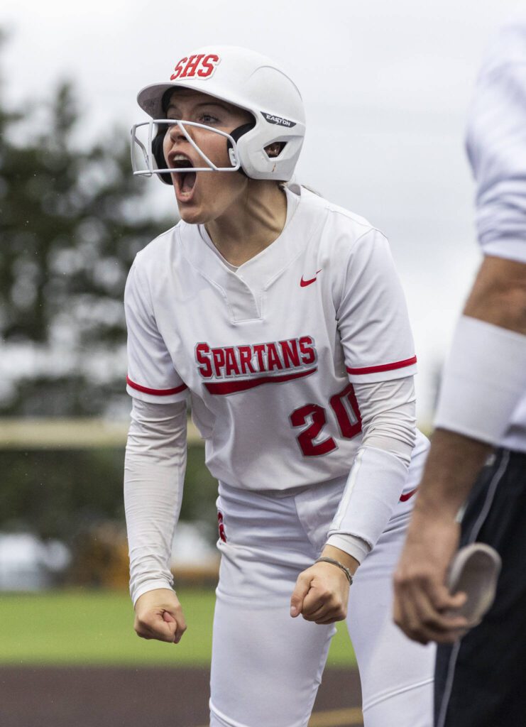 Stanwood’s Addi Anderson yells after getting a base hit during the 3A District 1 championship game against Sedro-Woolley on Thursday, May 15, 2025 in Everett, Washington. (Olivia Vanni / The Herald)
