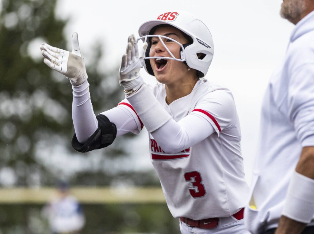 Stanwood’s Rubi Lopez cheers after getting a base hit during the 3A District 1 championship game against Sedro-Woolley on Thursday, May 15, 2025 in Everett, Washington. (Olivia Vanni / The Herald)
