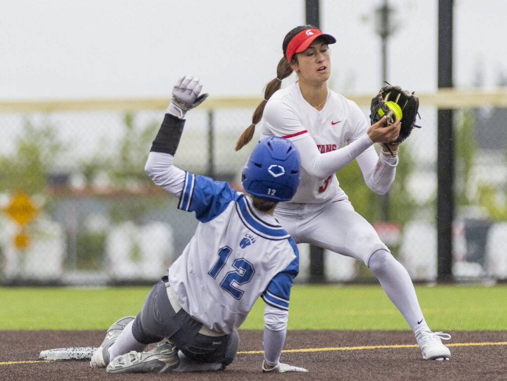 Stanwood’s Rubi Lopez gets an out at second base during the 3A District 1 championship game against Sedro-Woolley on Thursday, May 15, 2025 in Everett, Washington. (Olivia Vanni / The Herald)
