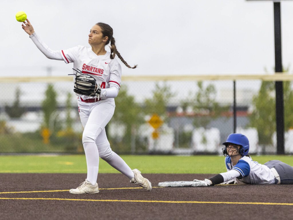 Stanwood’s Taylor Almanza throws the ball after getting an out at second base during the 3A District 1 championship game against Sedro-Woolley on Thursday, May 15, 2025 in Everett, Washington. (Olivia Vanni / The Herald)
