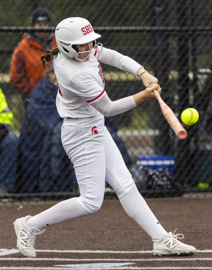 Stanwood’s Addi Anderson gets a hit during the 3A District 1 championship game against Sedro-Woolley on Thursday, May 15, 2025 in Everett, Washington. (Olivia Vanni / The Herald)
