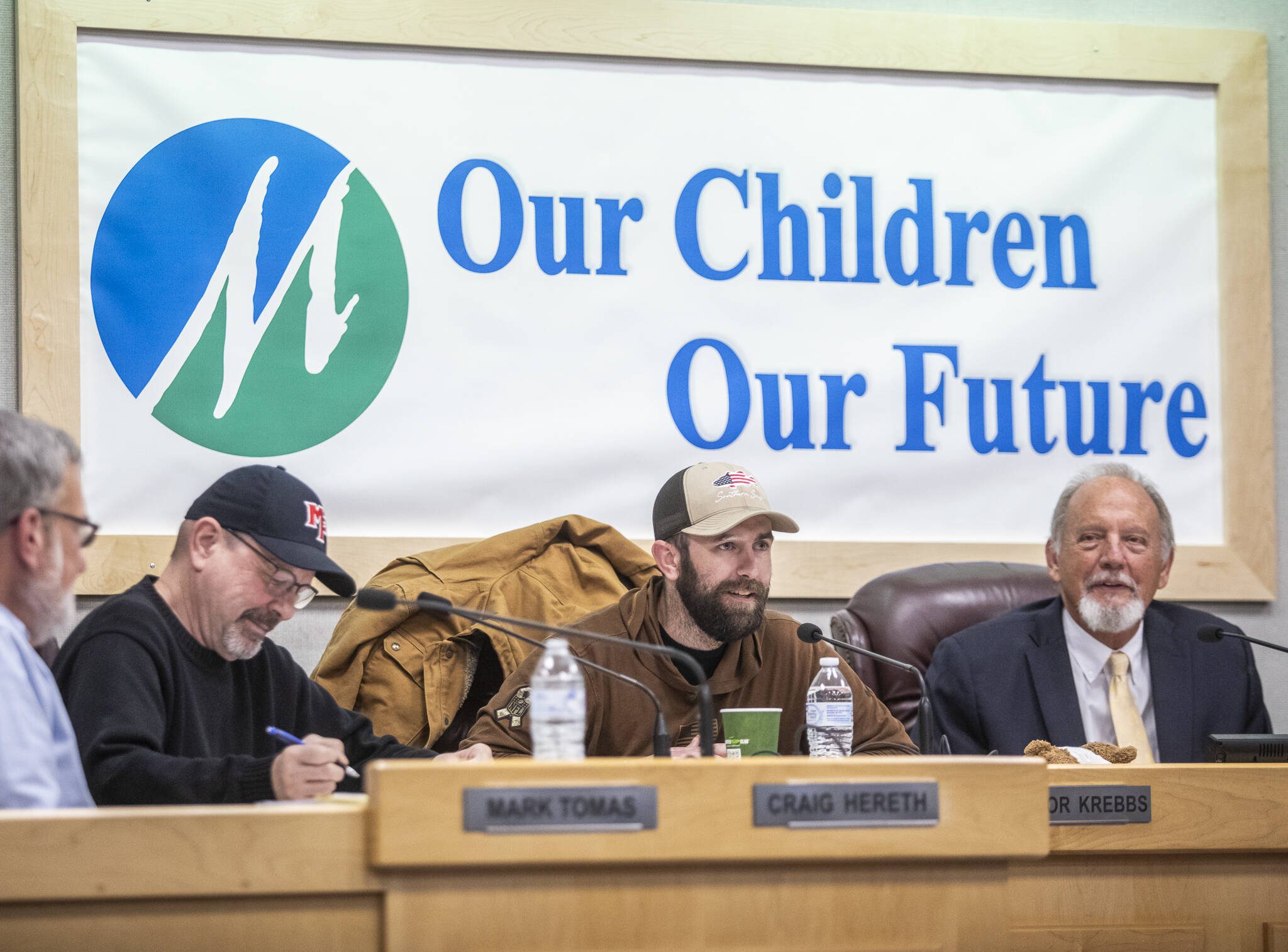 Marysville School Board President Connor Krebbs, center, speaks during a school board meeting before voting on school closures in the district on Wednesday, Jan. 22, 2025 in Marysville, Washington. (Olivia Vanni / The Herald)