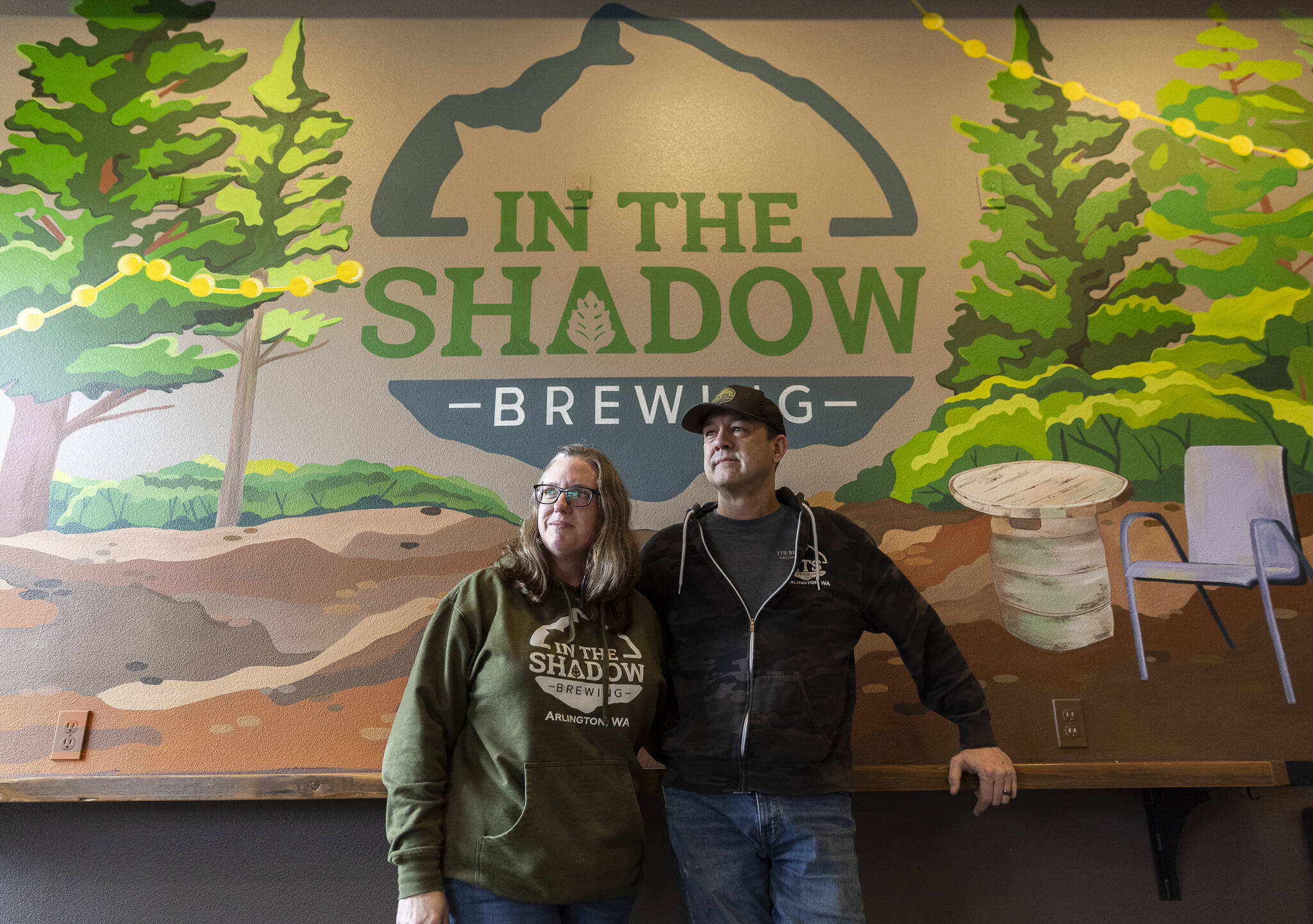 Sarah and Cole Rinehardt, owners of In The Shadow Brewing, on Wednesday, March 12, 2025 in Arlington, Washington. (Olivia Vanni / The Herald)