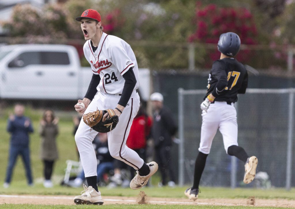 Snohomish’s Luke Davis yells after getting an out at first base during the opening round 3A state game against Bellevue on Tuesday, May 20, 2025 in Snohomish, Washington. (Olivia Vanni / The Herald)
