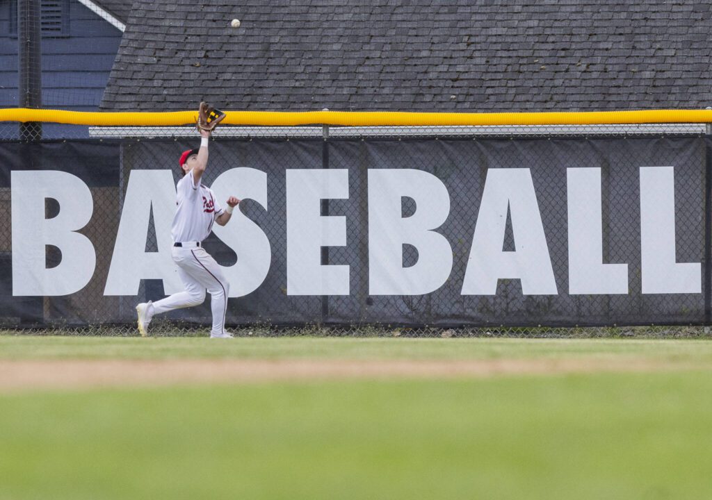 A Snohomish player makes a catch in the outfield during the opening round 3A state game against Bellevue on Tuesday, May 20, 2025 in Snohomish, Washington. (Olivia Vanni / The Herald)
