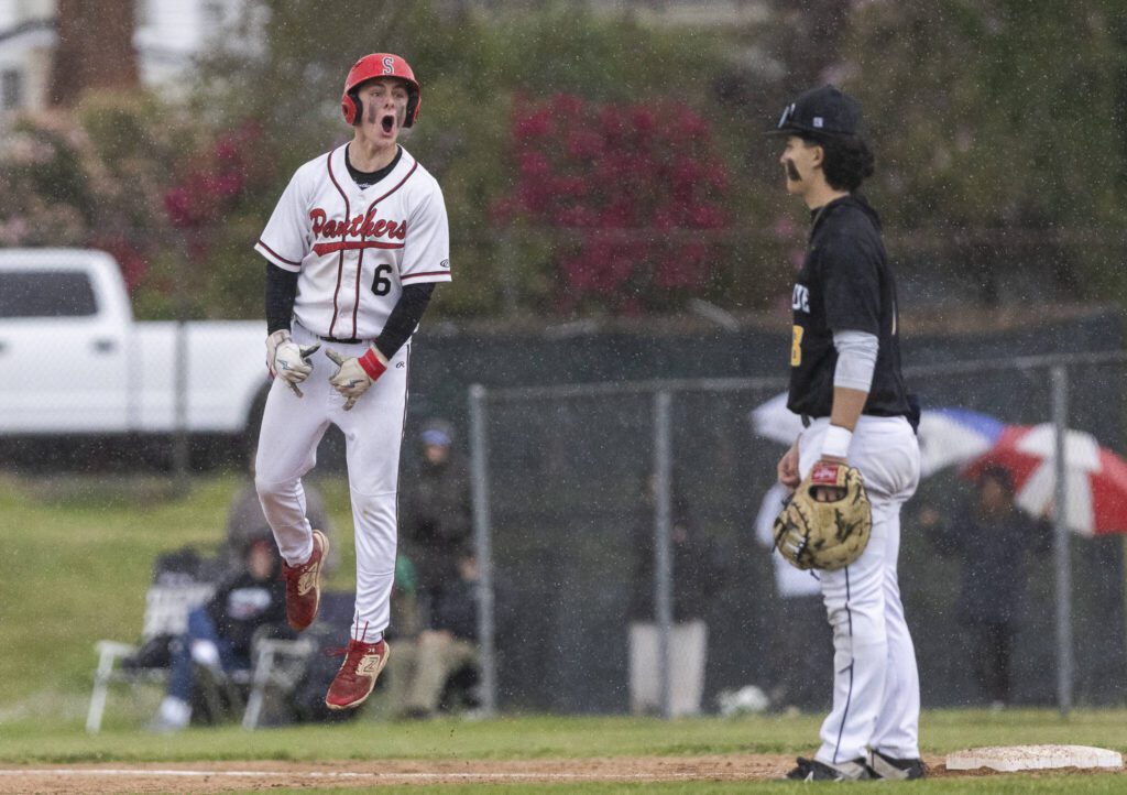 Snohomish’s Reve LeRoux yells after making it to first base during the opening round 3A state game against Bellevue on Tuesday, May 20, 2025 in Snohomish, Washington. (Olivia Vanni / The Herald)
