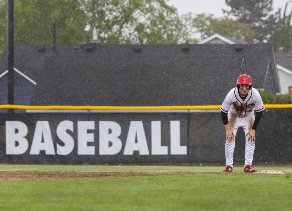 Snohomish’s Reve LeRoux wipes his hands on his pants as it rains during the opening round 3A state game against Bellevue on Tuesday, May 20, 2025 in Snohomish, Washington. (Olivia Vanni / The Herald)
