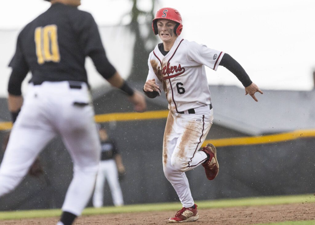 Snohomish’s Reve LeRoux runs to third base during the opening round 3A state game against Bellevue on Tuesday, May 20, 2025 in Snohomish, Washington. (Olivia Vanni / The Herald)
