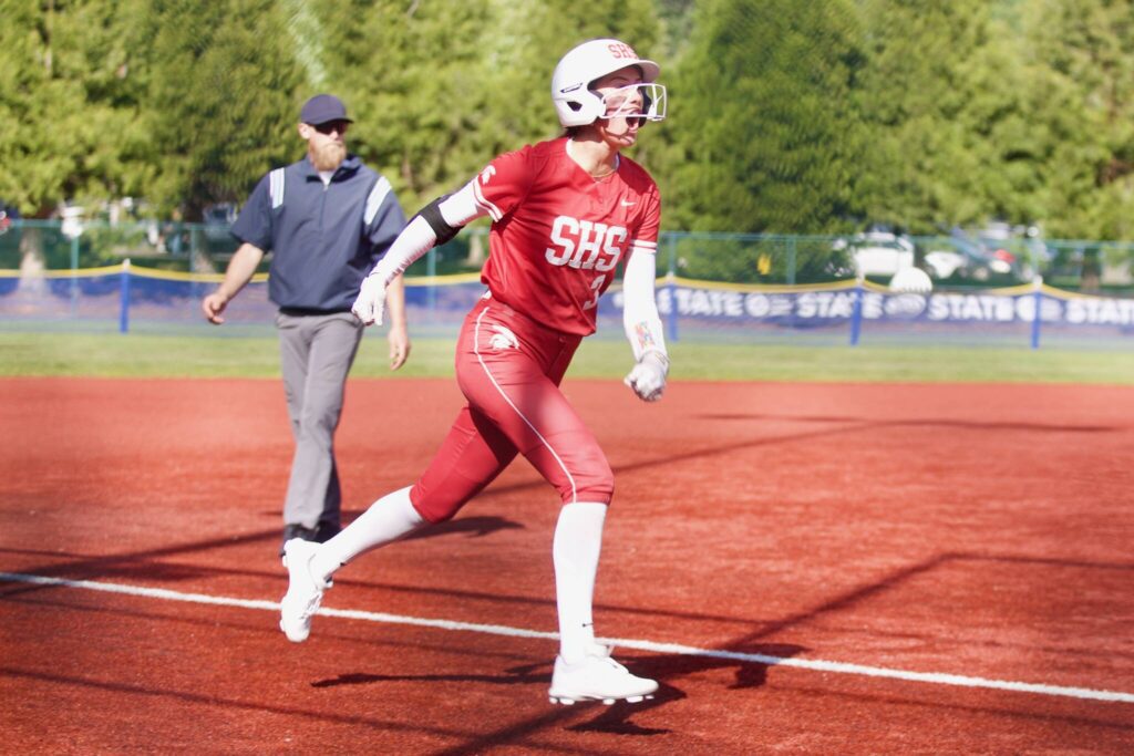 Stanwood senior Rubi Lopez celebrates rounding third after hitting a two-run home run during the Spartans’ 5-4 loss to Garfield in the 3A State Softball quarterfinals in Lacey, Washington on May 23, 2025. (Joe Pohoryles / The Herald)
