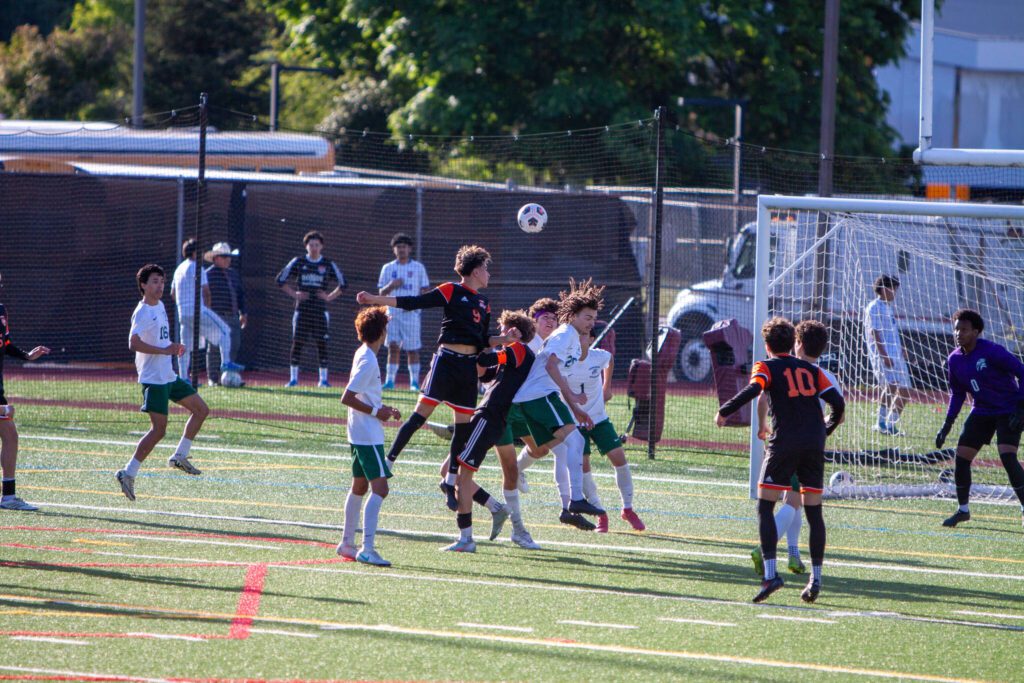 Monroe’s Tony Granados heads the ball toward the goal during a 3A State second-round game against Edmonds-Woodway on May 23, 2025 at Mercer Island High School. (Qasim Ali / The Herald)
