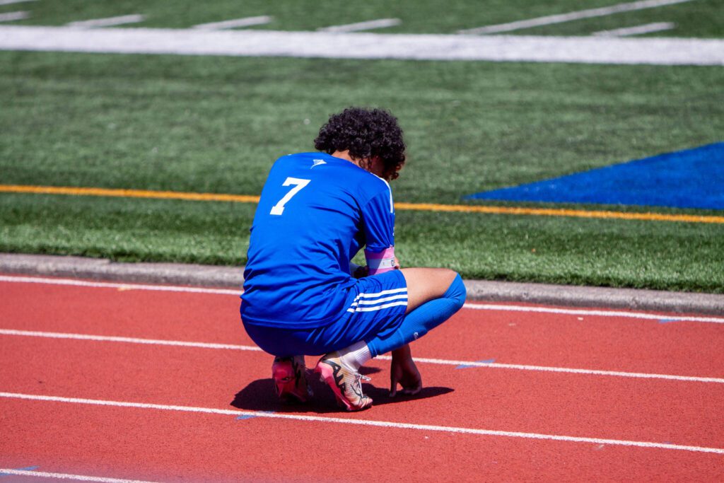 Shorewood’s Matthew Bereket takes a breather on the sideline during a 3A State boys soccer quarterfinal game against Bellevue on May 24, 2025 at Shoreline Stadium. (Qasim Ali / The Herald)
