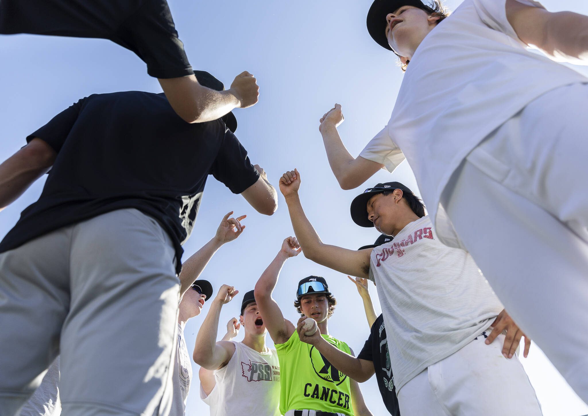 Jackson baseball players cheer before starting their next exercise during practice on Wednesday, May 28, 2025 in Mill Creek, Washington. (Olivia Vanni / The Herald)