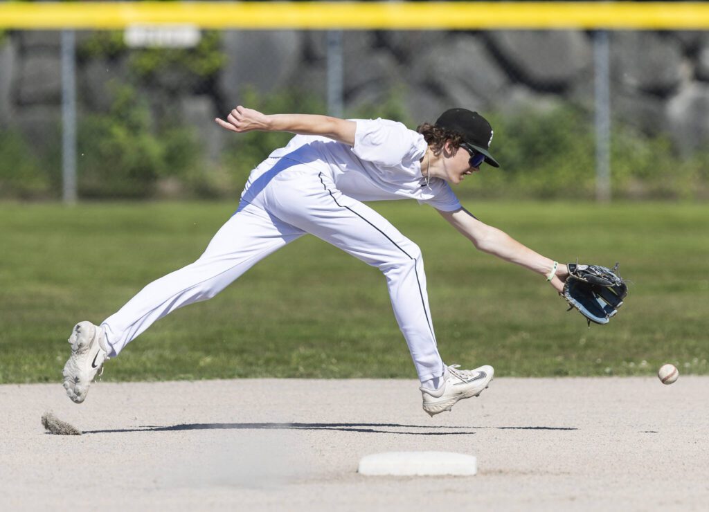 Jackson’s Colton White reaches out for a ball during practice on Wednesday, May 28, 2025 in Mill Creek, Washington. (Olivia Vanni / The Herald)
