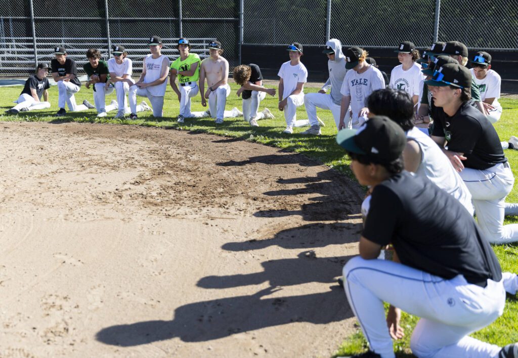Jackson players listen to head coach Joe Fleury during practice on Wednesday, May 28, 2025 in Mill Creek, Washington. (Olivia Vanni / The Herald)
