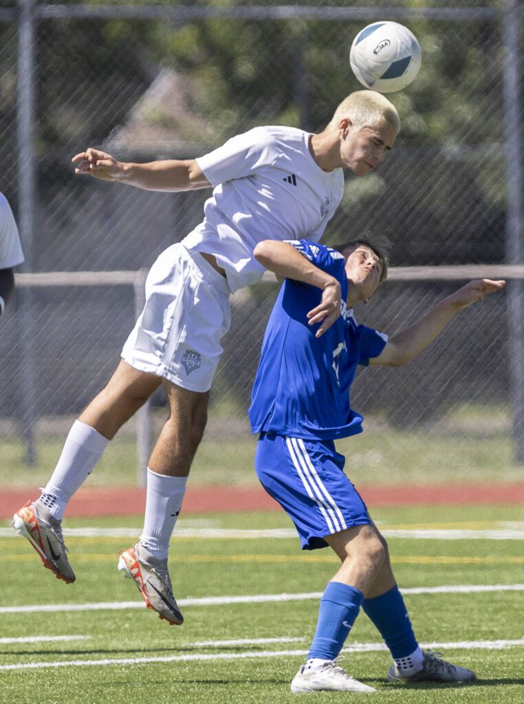 Shorewood’s Bobby Lamb tries to head the ball during the 3A state semifinal game against Ingraham on Friday, May 30, 2025 in Puyallup, Washington. (Olivia Vanni / The Herald)
