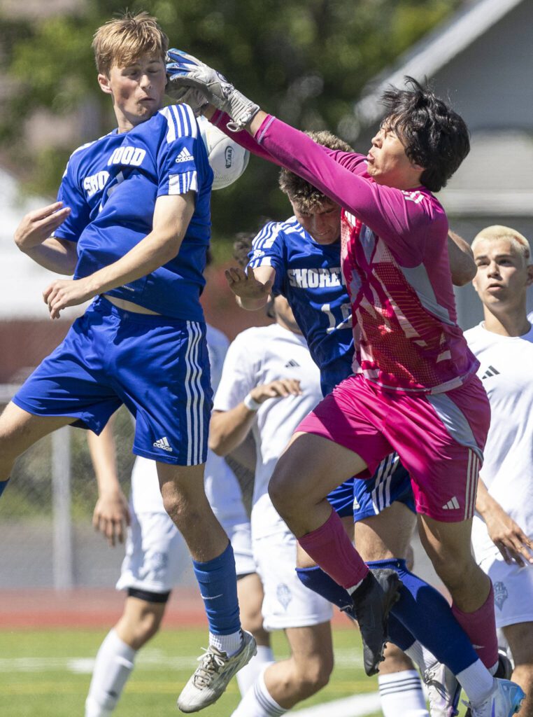 Shorewood’s Bobby Lamb tries to head the ball during the 3A state semifinal game against Ingraham on Friday, May 30, 2025 in Puyallup, Washington. (Olivia Vanni / The Herald)
