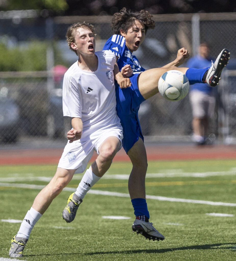 Shorewood’s Ian Baxter jumps to try and trap the ball during the 3A state semifinal game against Ingraham on Friday, May 30, 2025 in Puyallup, Washington. (Olivia Vanni / The Herald)
