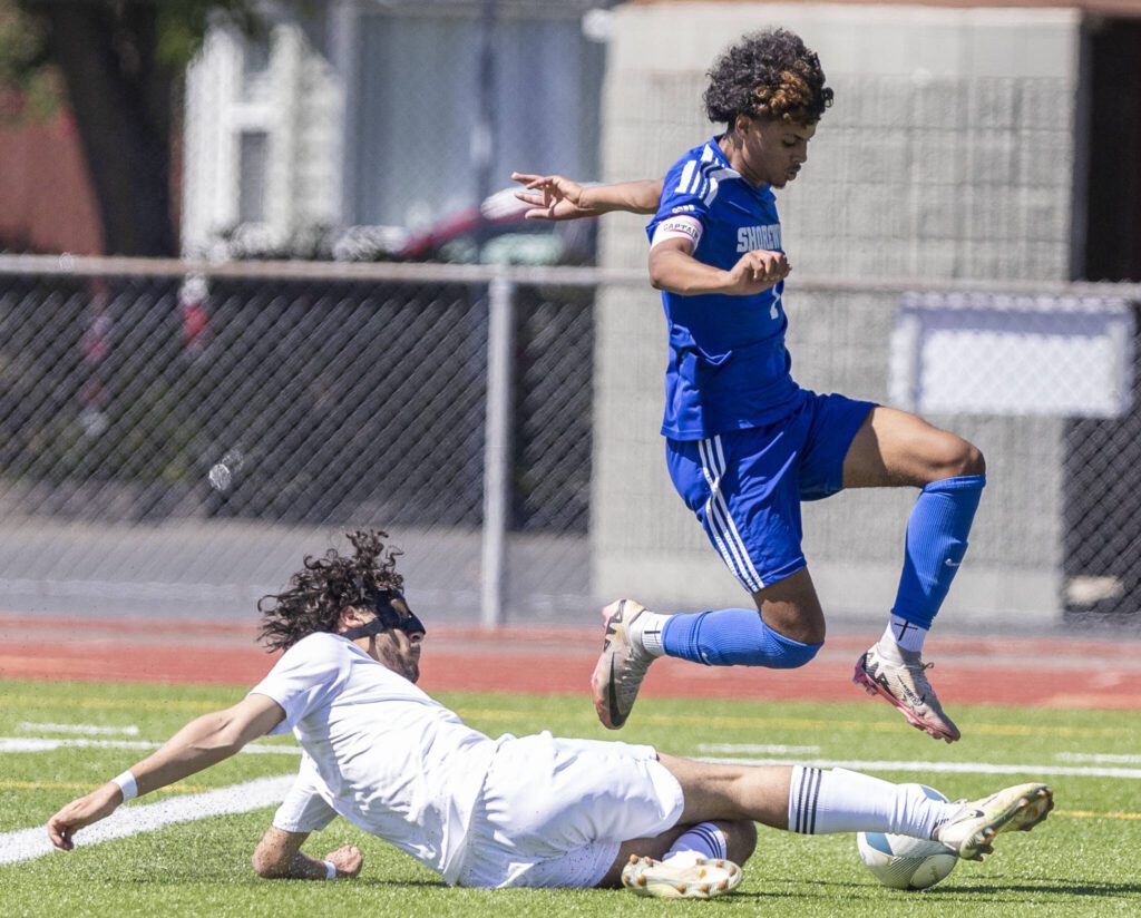 Shorewood’s Matthew Bereket leaps over a tackle during the 3A state semifinal game against Ingraham on Friday, May 30, 2025 in Puyallup, Washington. (Olivia Vanni / The Herald)
