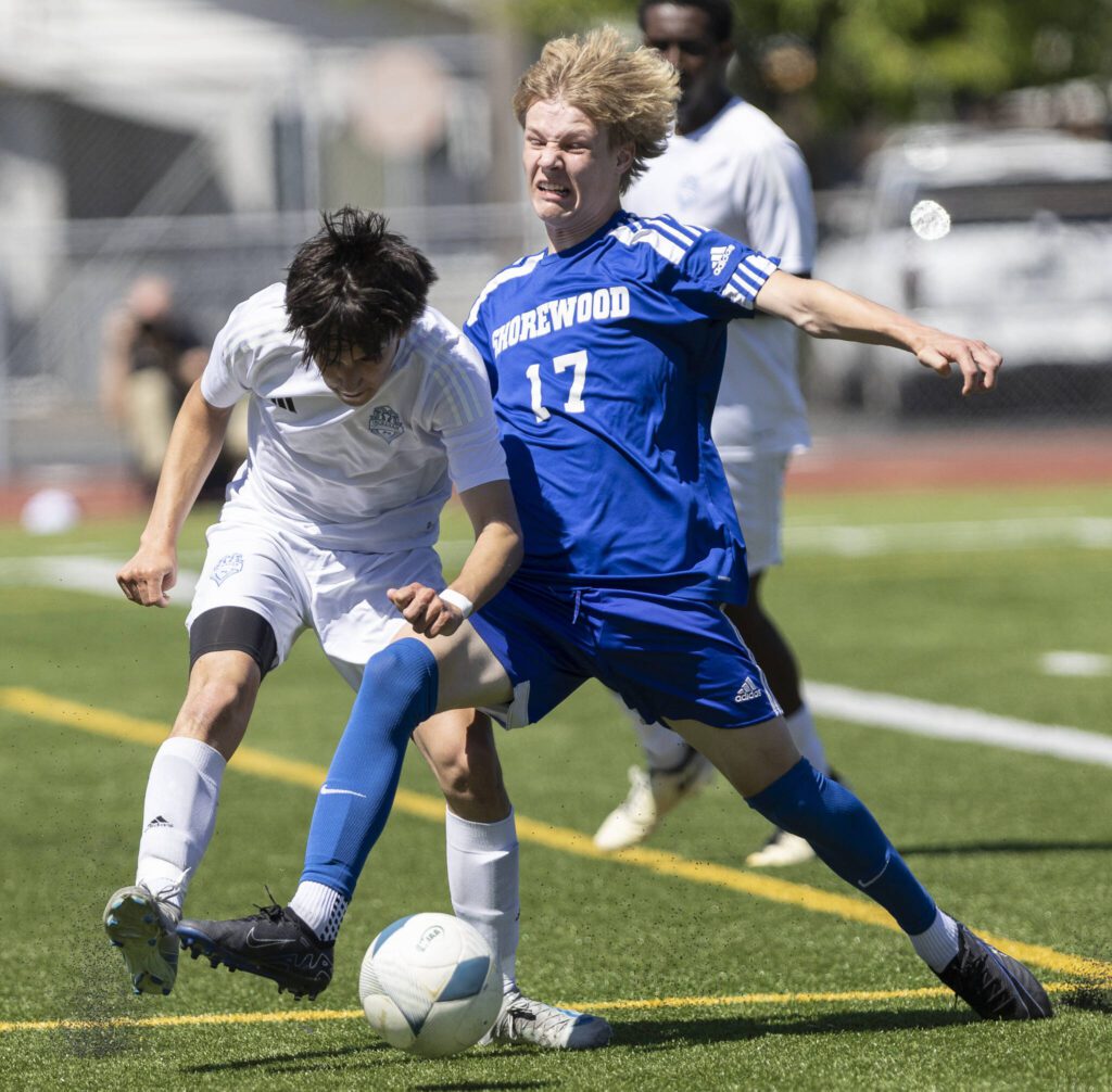 Shorewood’s Julian Shook tries to keep possession of the ball during the 3A state semifinal game against Ingraham on Friday, May 30, 2025 in Puyallup, Washington. (Olivia Vanni / The Herald)
