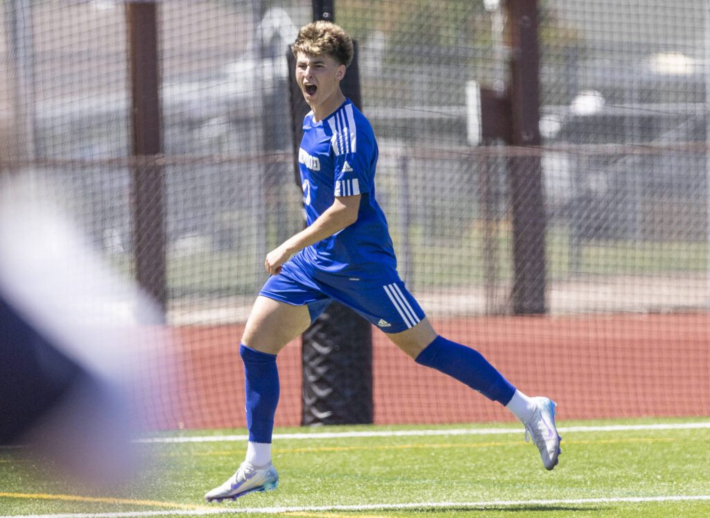 Shorewood’s Niki Genadiev yells after scoring a goal during the 3A state semifinal game against Ingraham on Friday, May 30, 2025 in Puyallup, Washington. (Olivia Vanni / The Herald)
