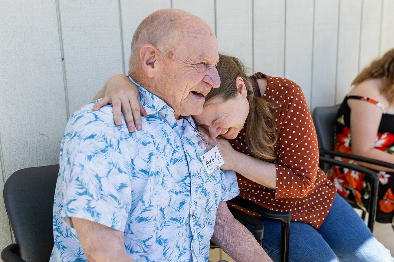 Jennifer Humelo, right, hugs Art Cass outside of Full Life Care Snohomish County on Wednesday, May 28, 2025 in Everett, Washington. (Olivia Vanni / The Herald)