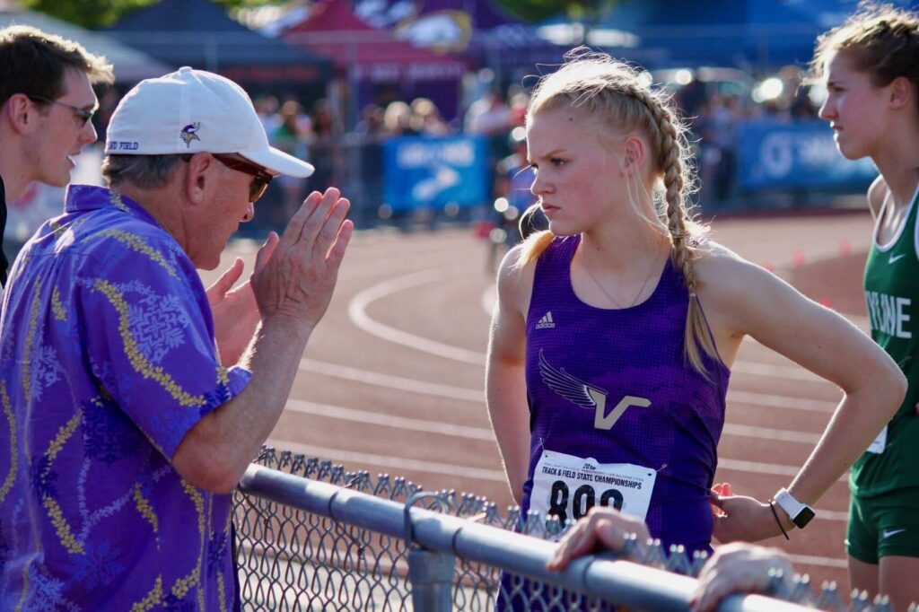 Jeff Page gives instruction to Addy Boak during a Lake Stevens track meet in 2018. (Photo courtesy of Jeff Page)
