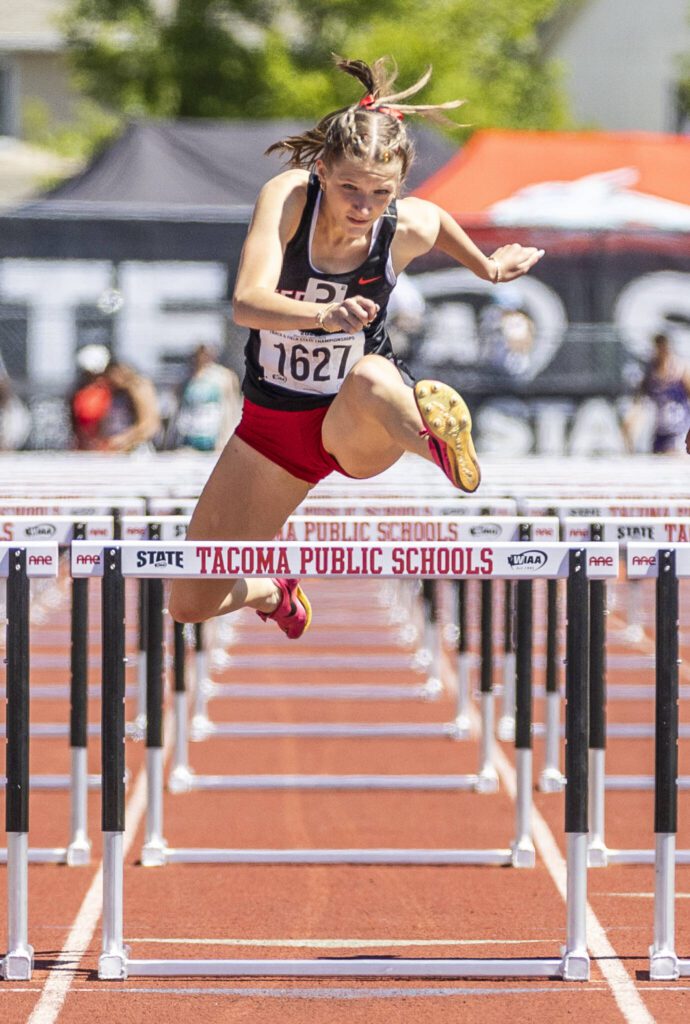Mountlake Terrace’s Brynlee Dubiel leaps over the last hurdle in the 3A Girls 110 Hurdles final on Friday, May 30, 2025 in Tacoma, Washington. (Olivia Vanni / The Herald)
