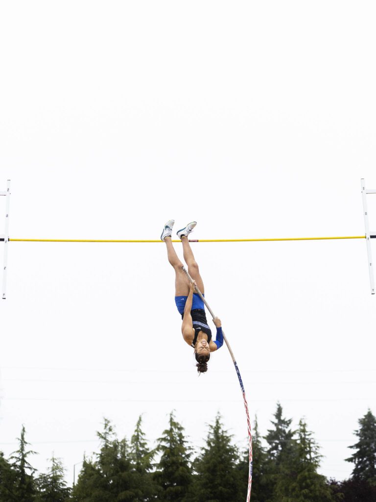 Shorewood’s Ava Enriquez maneuvers over the bar in the 3A girls pole vault final on Saturday, May 31, 2025 in Tacoma, Washington. (Olivia Vanni / The Herald)
