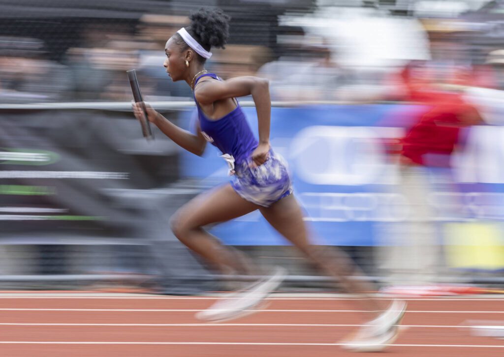 Lake Stevens’ Haddyjatou Ceesay runs off the starting block in the 4A girls 4×100 relay final on Saturday, May 31, 2025 in Tacoma, Washington. (Olivia Vanni / The Herald)
