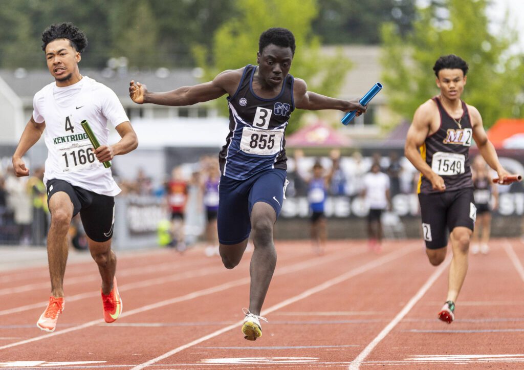 Glacier Peak’s Alieukama Badjie crosses the finish line in the 4A boys 4×100 relay final on Saturday, May 31, 2025 in Tacoma, Washington. (Olivia Vanni / The Herald)
