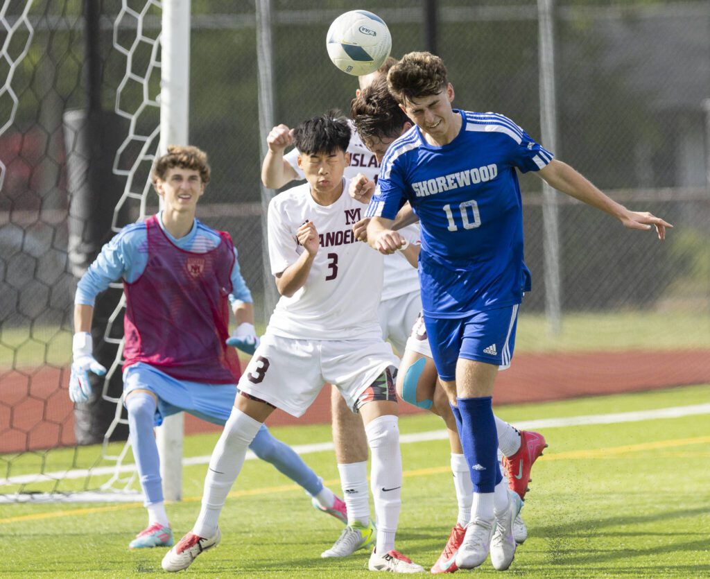 Shorewood’s Niki Genadiev heads the ball from a corner kick during the 3A state championship game against Mercer Island on Saturday, May 31, 2025 in Puyallup, Washington. (Olivia Vanni / The Herald)

