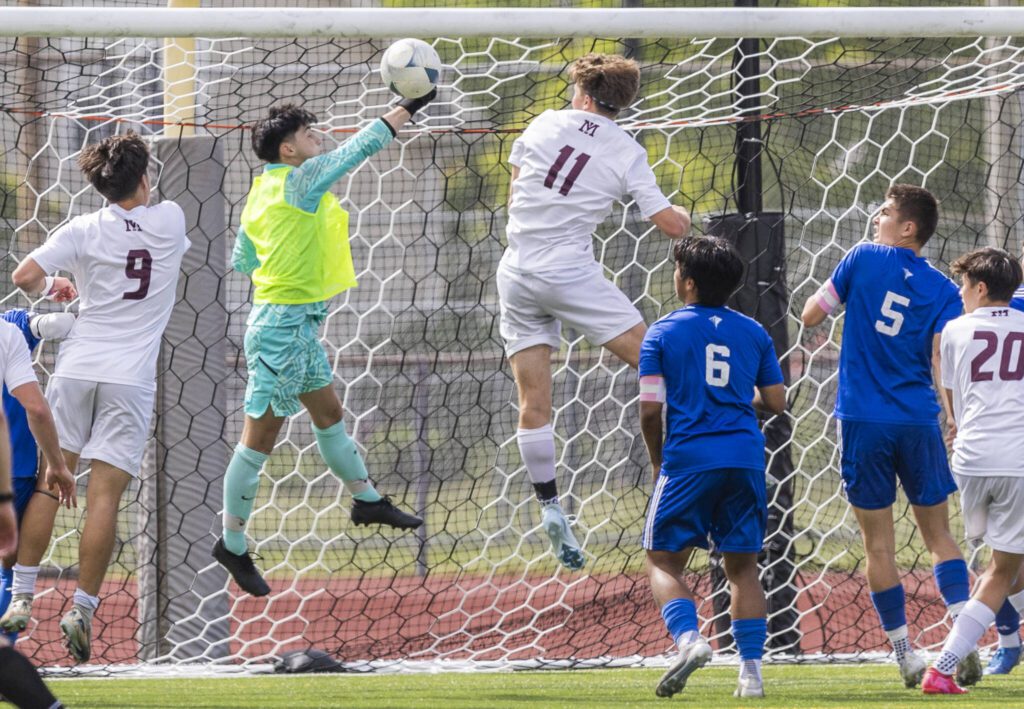 Shorewood’s Ivan Genadiev punches the ball over the top of the goal post during the 3A state championship game against Mercer Island on Saturday, May 31, 2025 in Puyallup, Washington. (Olivia Vanni / The Herald)
