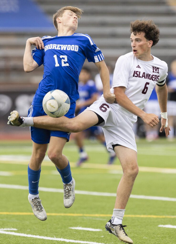 Shorewood’s Bobby Lamb jumps to try and trap the ball during the 3A state championship game against Mercer Island on Saturday, May 31, 2025 in Puyallup, Washington. (Olivia Vanni / The Herald)
