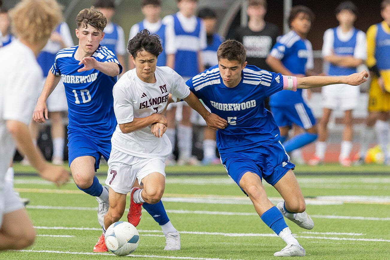 Shorewood’s Niki Genadiev and Daniel Bruno runs after the ball during the 3A state championship game against Mercer Island on Saturday, May 31, 2025 in Puyallup, Washington. (Olivia Vanni / The Herald)