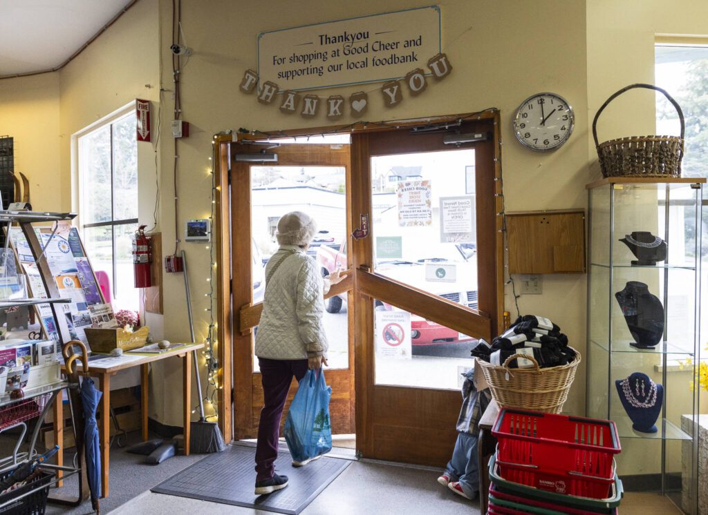 A customer walks out of the Good Cheer Thrift Store in Langley. (Olivia Vanni / The Herald)
