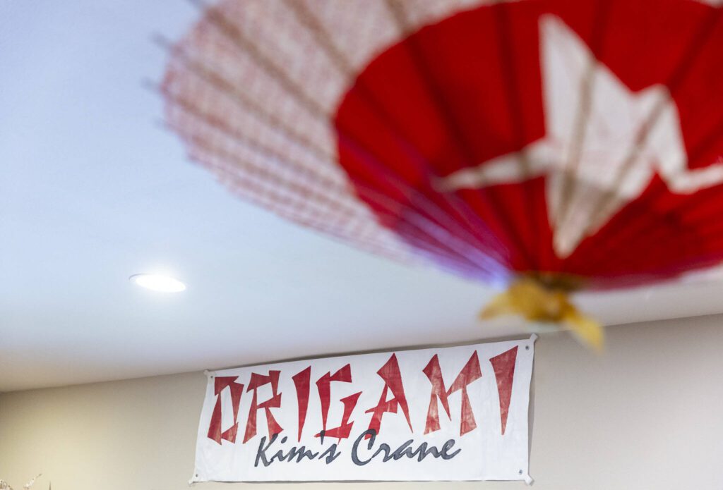 A Kim’s Crane sign hangs on the wall inside the showroom on Monday, Feb. 17, 2025, in Snohomish, Washington. (Olivia Vanni / The Herald)
