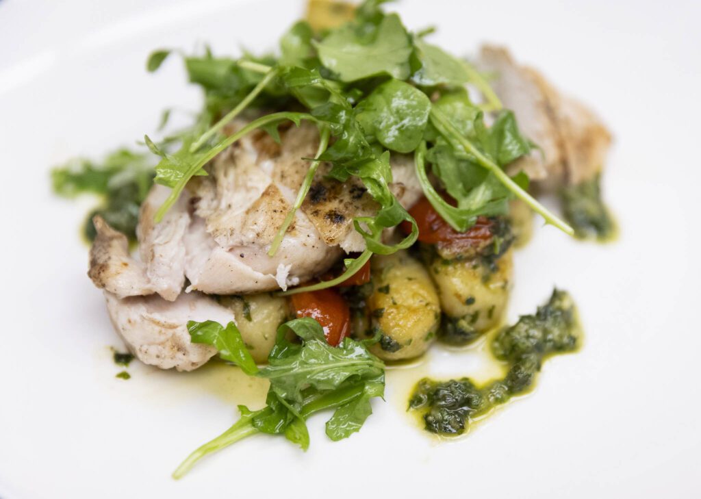 Pesto gnocchi with grilled chicken, tomato, parmesan and arugula salad at the Edmonds College Cafe on Thursday, May 29, 2025 in Lynnwood, Washington. (Olivia Vanni / The Herald)
