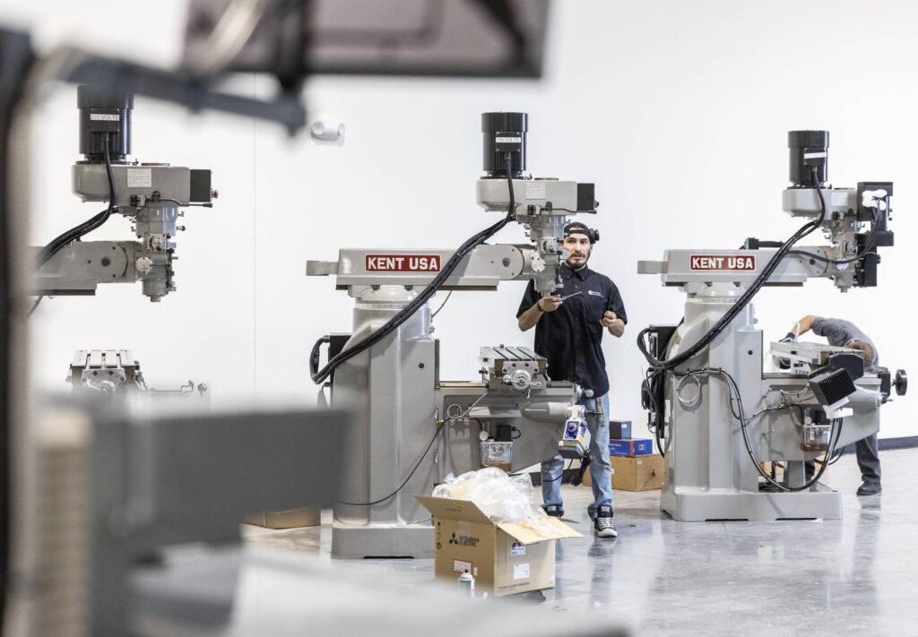 Izaac Escalante-Alvarez unpacks a new milling machine at the new Boeing machinists union’s apprentice training center on Friday, June 6, 2025 in Everett, Washington. (Olivia Vanni / The Herald)
