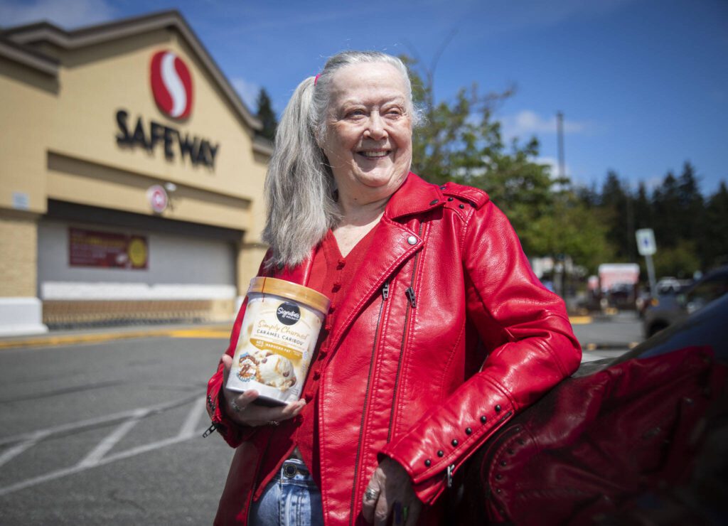 Louise Grevstad, 79, with her free ice cream outside of Safeway on Thursday, May 30, 2024, in Lynnwood, Washington. (Olivia Vanni / The Herald)
